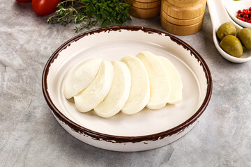 Wall Mural - Organic mozzarella cheese slices in the plate