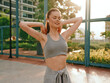 © SHOTPRIME STUDIO - Young woman stretching outdoors in sportswear during golden hour light