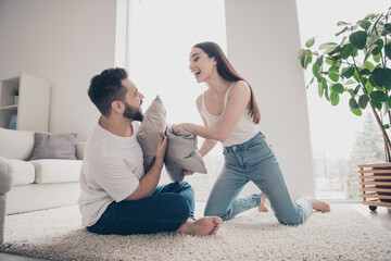 Poster - Photo of pretty cheerful lady guy wear casual looks smiling having fun together indoors room home house