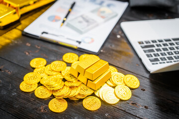 Businessman in suit sits at his desk, holding a shining gold bar. financial charts, the scene symbolizes wealth, investment success, growing influence of cryptocurrency and blockchain.