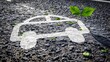 © VICHIZH - Abstract concept of eco friendly transport with a car outline and a green leaf on a gravel road