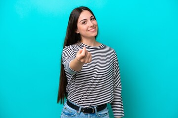 Wall Mural - Young caucasian woman isolated on blue background making money gesture