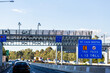 © Austockphoto - E-tag toll road start sign above highway with licence plate cameras