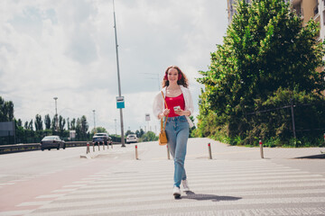 Poster - Full body photo of cheerful adorable girl cross road going good mood wear white shirt enjoying free time sunny weather outdoors modern city