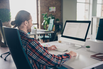 Photo of young corporate man use computer wear shirt loft interior modern office indoors