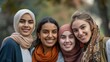 © P - Young women of various ethnicities, standing close and smiling warmly