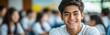 © monvideo - A cheerful high school student enjoys his time in class with classmates around him