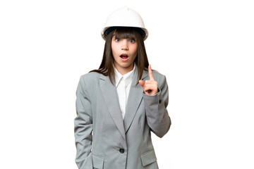 Sticker - Little girl playing as a architect with helmet and holding blueprints over isolated background intending to realizes the solution while lifting a finger up