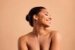 © deagreez - Photo of gorgeous cheerful woman enjoy body selfcare naked shoulders isolated on beige pastel color background