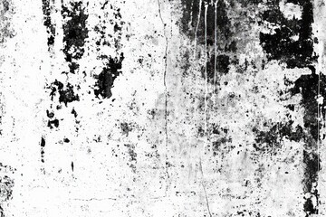 Aufkleber - A textured wall displays a mix of black and white patches, revealing layers of age and wear, contributing to an antique and rustic atmosphere
