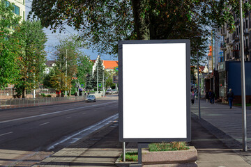 Vertical blank white street billboard in the city. Advertising banner with copy space. Mock up