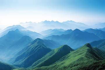 Wall Mural - Majestic mountain landscape with rolling hills and hazy blue skies