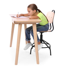 Wall Mural - Girl with incorrect posture and notebook sitting at wooden desk on white background