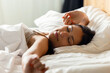 © nenetus - Beautiful young woman stretching in the bed after wake up