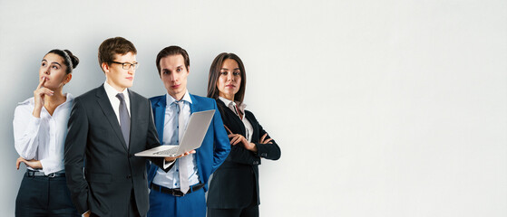 Poster - Group of businesspeople in formal attire standing against a plain wall background.
