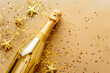 © Starmarpro - Open a champagne bottle with confetti and sparkles. Birthday anniversary Christmas Valentine day background with copy space. High quality photo
