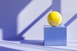 © typepng - 3D image of a yellow sphere or ball balanced at the edge of a cube geometric shape on a blue background.