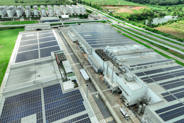 Wall Mural - Solar energy for factory and warehouse building. Solar panels on roof of industrial plant. Commercial solar power. Rooftop solar power. Rooftop renewable energy system. Sustainable green energy.