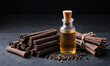 © Miklos - A bottle of cinnamon oil sits next to a pile of cinnamon