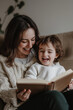© CarolineJeff - Child Happily Reading Book