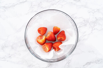 Poster - Washed and Dried Strawberries Neatly Stored in a Glass Bowl