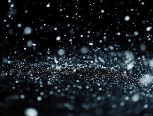 Wall Mural - snow falling on a black background, with snowflakes and particles in a depth of field