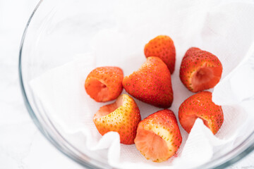 Poster - Washed and Dried Strawberries Neatly Stored in a Glass Bowl