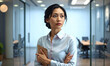 © h - Confident Asian Businesswoman in a Cold-Toned Modern Office with Blurred Background