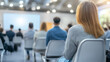 © Papugrat - a group of people seated in a conference room, attentively listening to a speaker at a business meeting or seminar