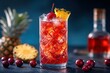 © Graph Squad - A glass of red drink with a cherry on top and a pineapple slice
