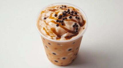 Poster - A high-angle shot of a cup of freshly made brown sugar bubble tea, the caramel swirls and tapioca pearls standing out against a simple white background.