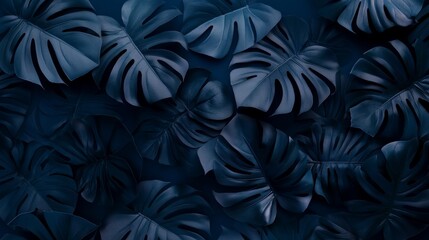 Wall Mural - An abstract background featuring overlapping dark blue tropical leaves. An intricate pattern with intricate details and shadows.