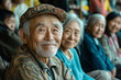 © Topuria Design - Portrait of a smiling old Chinese man at a community gathering, looking at camera. A group of senior people enjoying meeting and socializing at a peaceful outdoor location.