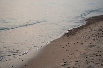 blue sea and brown coastal sand