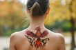 © atar - Phoenix tattoo on woman's back, red, orange, yellow,  body art, rebirth, mythical creature, fire