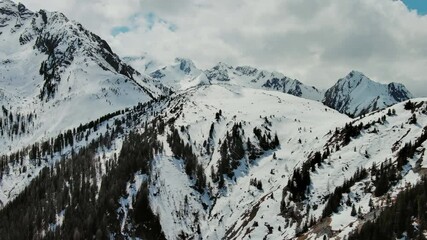 Wall Mural - Aerial view of snow mountain range landscape with clouds. Alps mountains, Austria, 4k