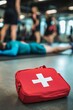 © olegganko - First aid kit in a gym setting during a health and safety training session for attendees