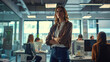 © OLHA - A woman standing in an office with her arms crossed