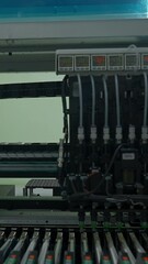 Poster - Automatic pick and place machine is installing components on circuit board. Creative. Assembly line on electronics and circuit board manufacturing factory.