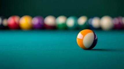 Colorful billiard balls on a pool table with a blurred outdoor background during sunny hours