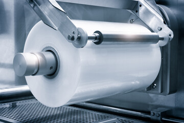 Poster - Fragment of the conveyor of the pharmaceutical labeling machine. industrial concept background.