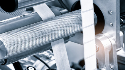 Poster - Fragment of the conveyor of sticking labeling machine. Abstract industrial background.