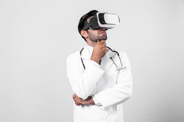 Caucasian doctor making decision and thinking about medical data. Professional doctor enter in metaverse and virtual reality world while wearing lab coat and VR glasses. Innovation concept. Deviation.