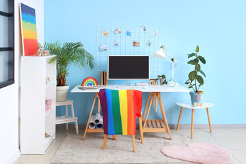 Wall Mural - Interior of office with workplace, LGBT flag and painting