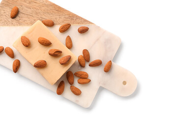 Sticker - Cutting board with tasty marzipan bar and almond nuts on white background