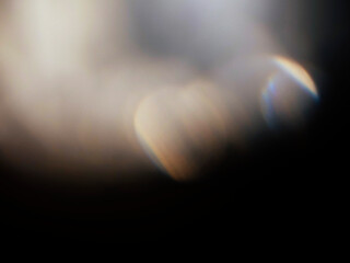 Wall Mural - colorful light leak on dark background. cinematic visual lens effect for design and creative ideas. 