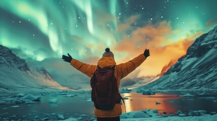 Wall Mural - An individual backpacking Visit the Lofoten Islands in Norway to witness the Northern Lights The frozen ocean and mountains of the Northern Lights at night. Travel to Norway.