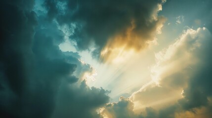 Wall Mural - dramatic clouds with sunlight breaking through sky