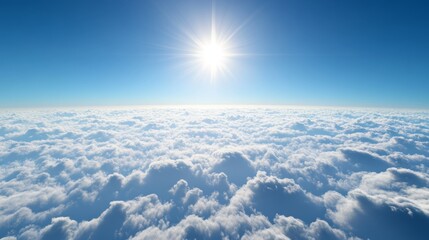 a bright sky above thin clouds, vivid blue with a tiny bright sun just rising