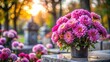 © lapeepon - Pink chrysanthemums on a gravestone in cemetery during All Saints Day, gravesite, decoration, tradition